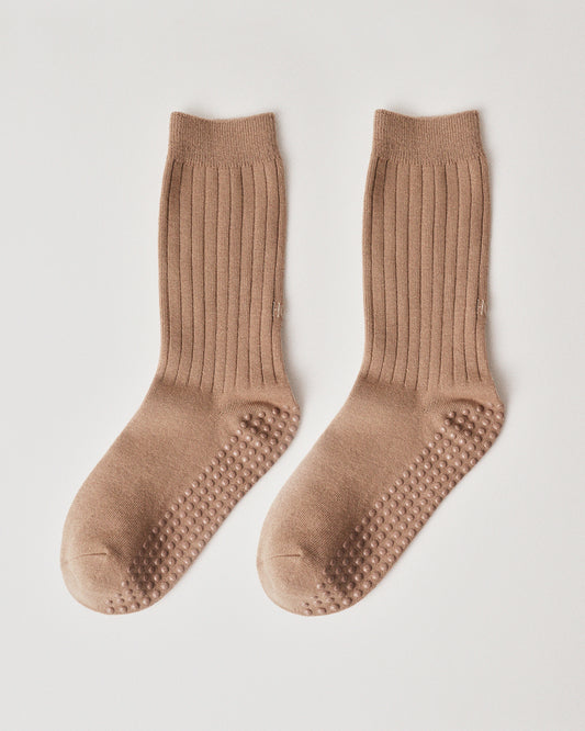Pair of sand socks with grip sole on a wight background